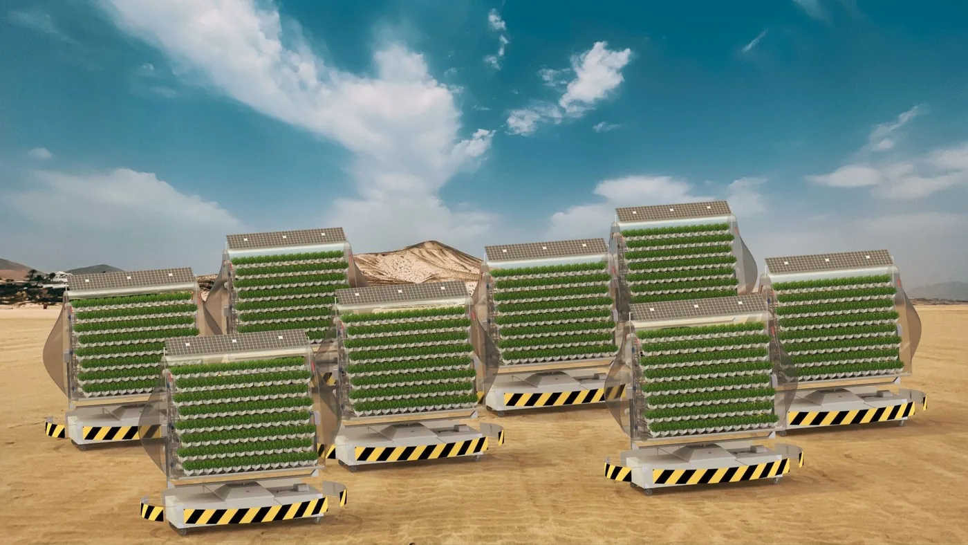 Design render of a fleet of vertical farming modules with aeroponic growing chambers in a desert setting